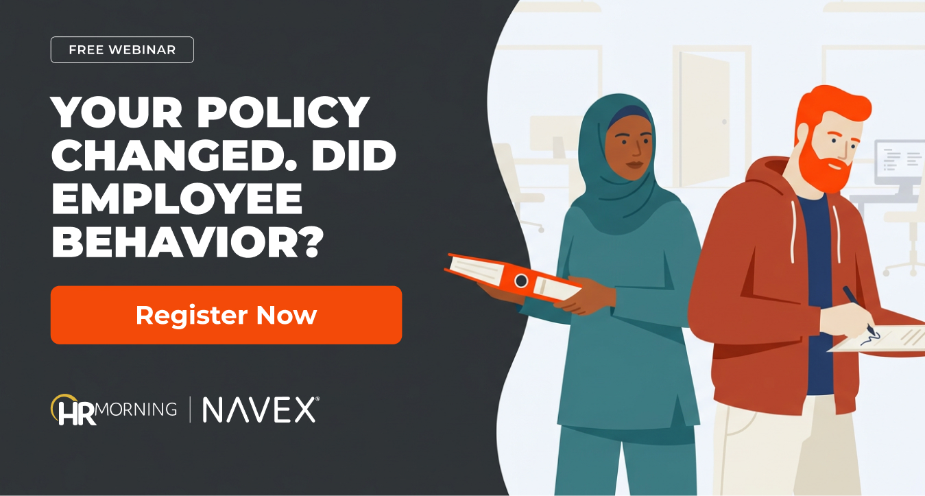 Compliance lead holds out a revised policy binder while an employee keeps signing the old form