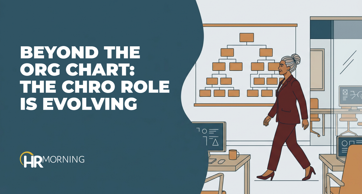 CHRO walking away from a wall org chart on an executive floor, illustrating the evolving CHRO role