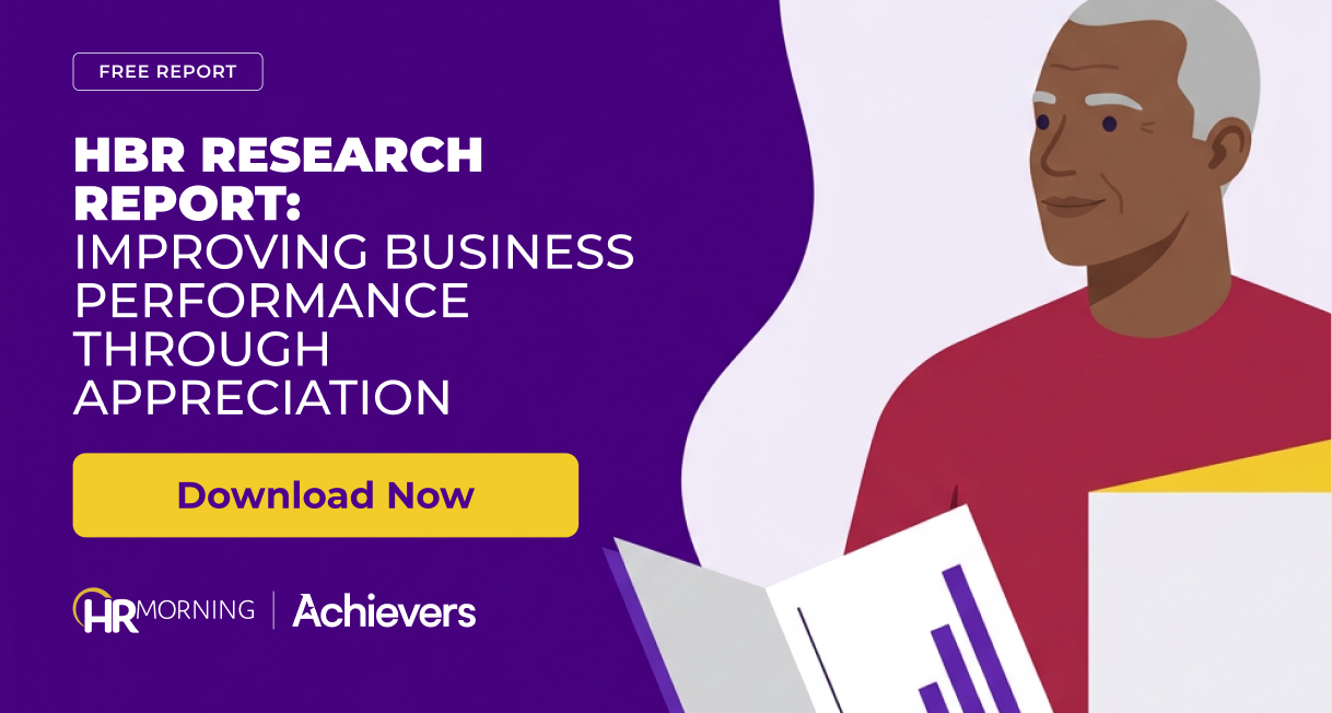 Executive holding an open report with a rising bar chart, for an Achievers HBR report on appreciation and business performance